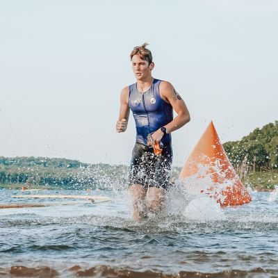 Joshua Blanchard finishing his swim during the 2023 Tulsa Triathlon at Birch Lake in Barnsdall,Oklahoma