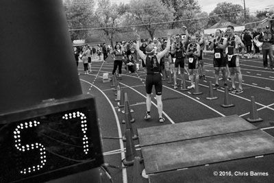 Finishers welcome other athletes at the finish line during the 2016 Spring Fever Sprint Triathlon